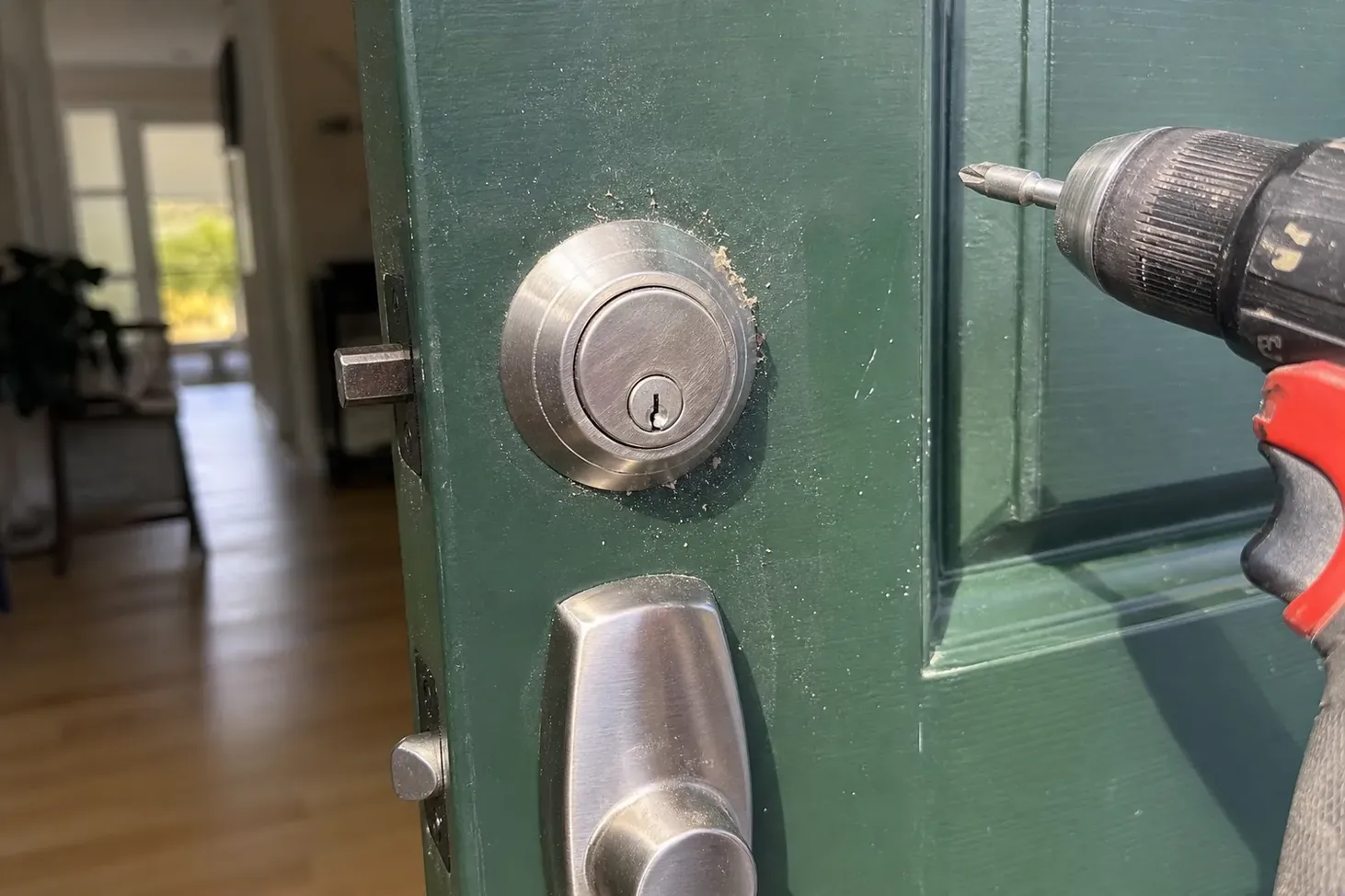 New deadbolt being installed in a front door